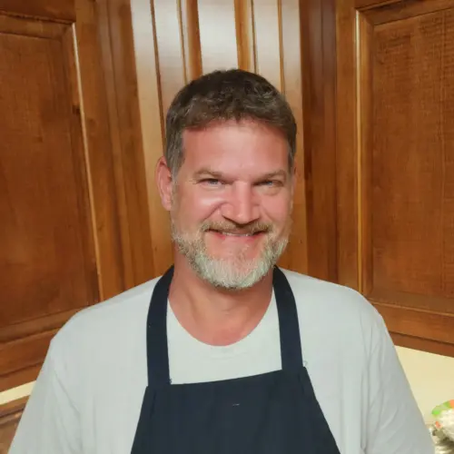 the author standing in the kitchen